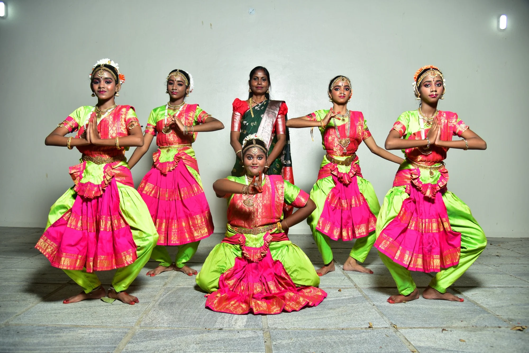Classical dance students presenting traditional poses