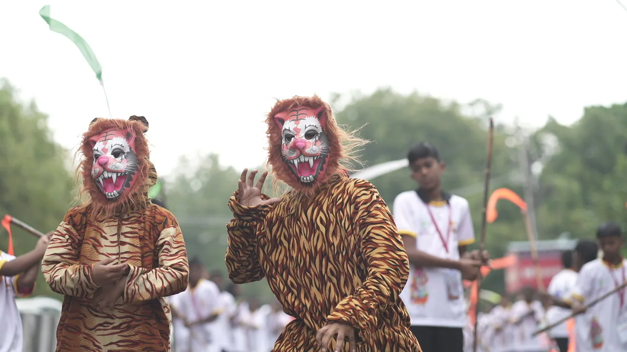 Two folk performers in tiger costumes