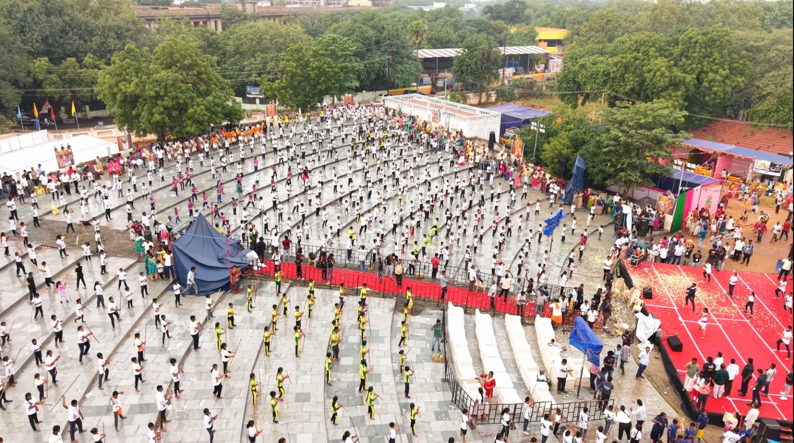 A large outdoor gathering of Silambam participants